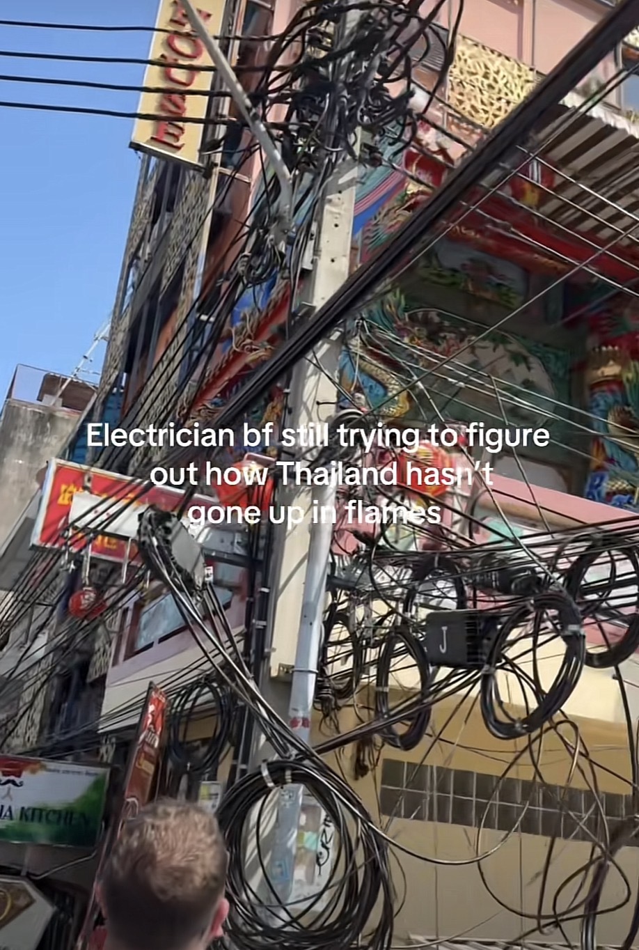 Photo of dozens of wires together on an electrical pole with the caption “Electrician bf still trying to figure out how Thailand hasn't gone upin flames”