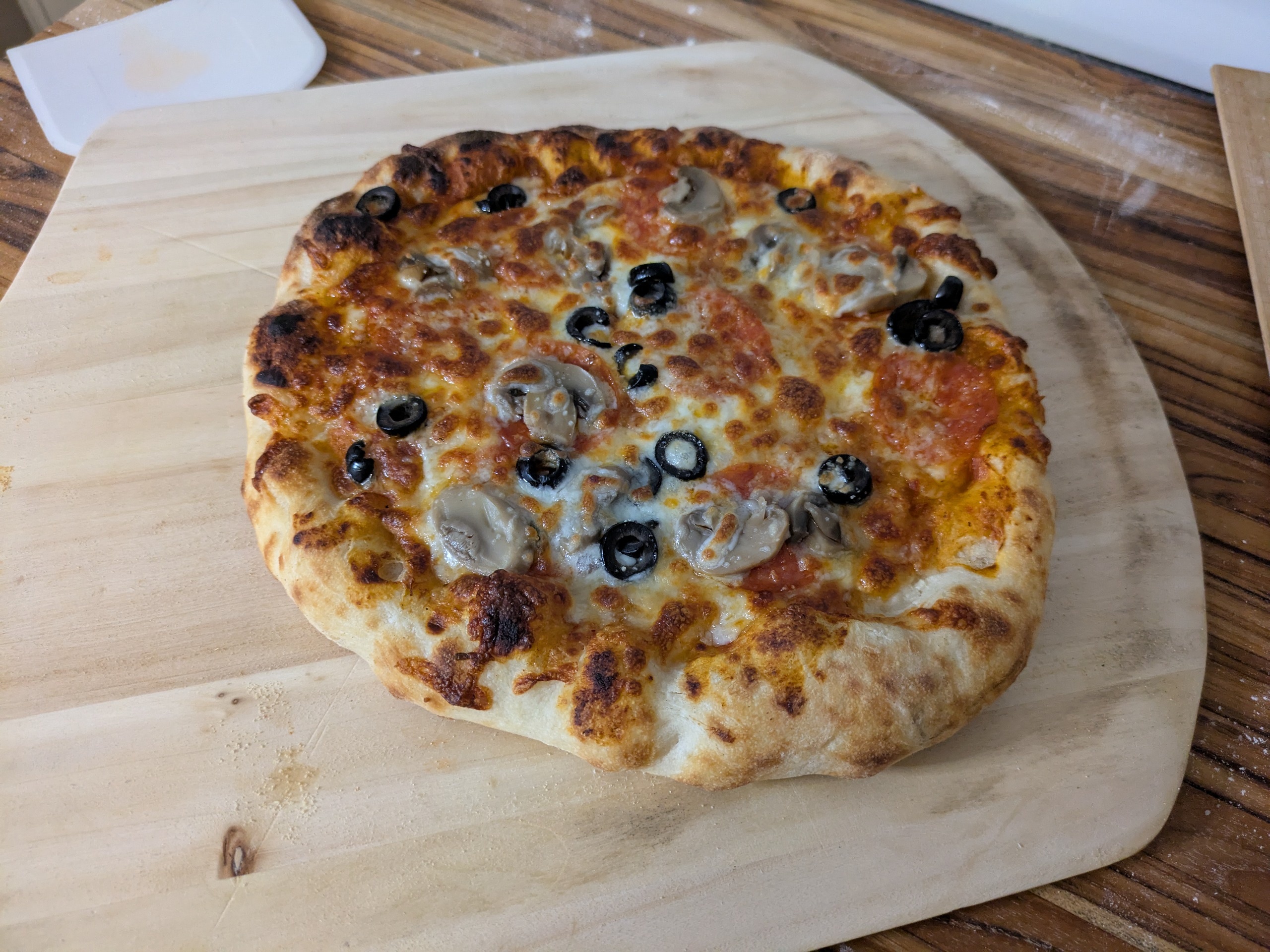 Pizza on a pizza peel